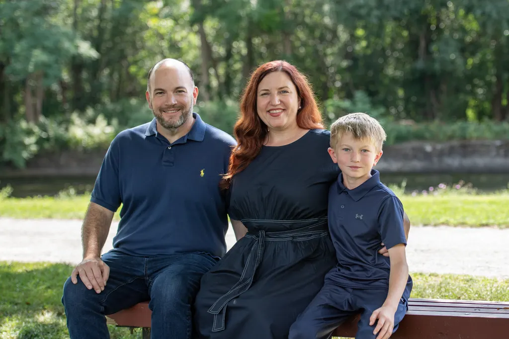 Jen Lunsford with her husband and son on a park bench